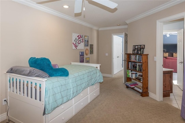 carpeted bedroom with tile patterned floors, a ceiling fan, baseboards, and ornamental molding