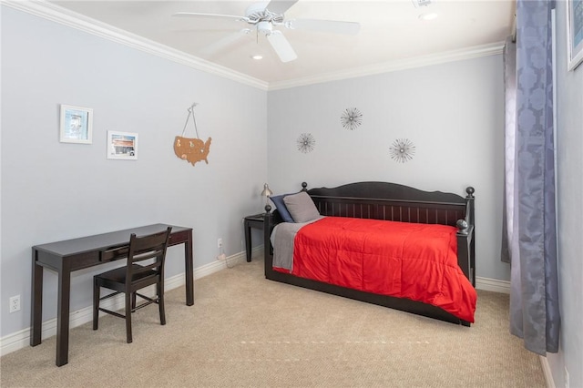 bedroom featuring baseboards, carpet floors, ornamental molding, and a ceiling fan