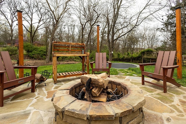 view of patio / terrace with an outdoor fire pit