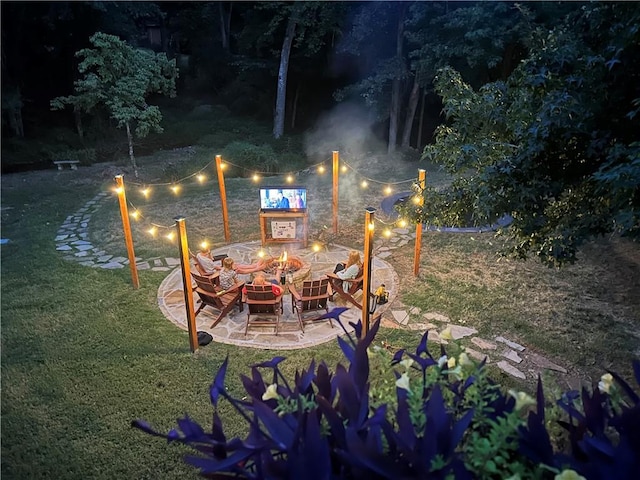 view of patio / terrace featuring an outdoor fire pit