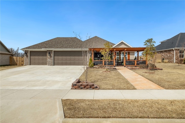 view of front of house featuring driveway, a porch, an attached garage, a shingled roof, and brick siding