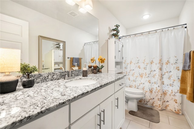 bathroom with visible vents, toilet, a shower with shower curtain, tile patterned floors, and vanity