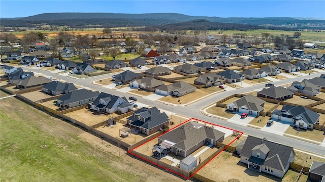 birds eye view of property with a residential view and a mountain view