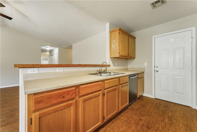 kitchen with visible vents, dark wood-type flooring, lofted ceiling, stainless steel dishwasher, and a sink