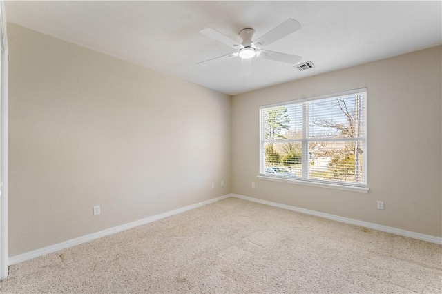 unfurnished room with a ceiling fan, baseboards, visible vents, and carpet floors