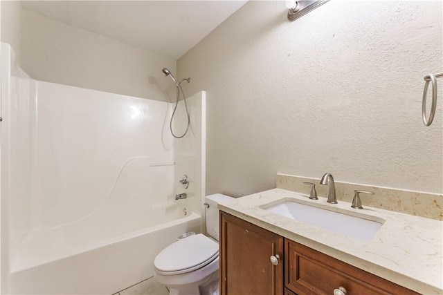 full bath featuring tub / shower combination, toilet, vanity, and a textured wall