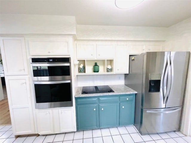 kitchen featuring blue cabinets, open shelves, white cabinetry, appliances with stainless steel finishes, and light tile patterned floors