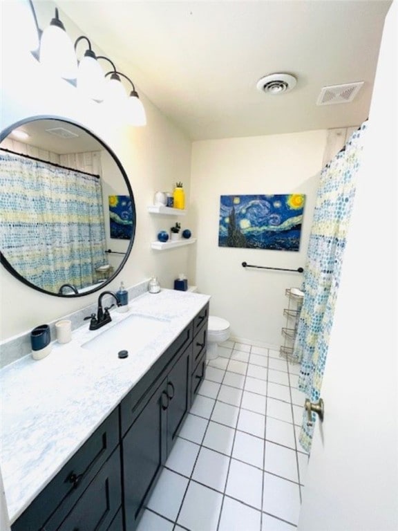 full bathroom with vanity, tile patterned floors, toilet, and visible vents