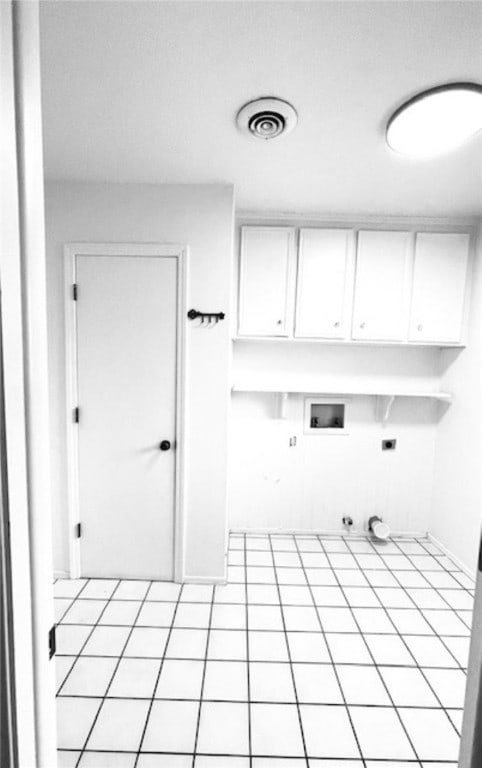 laundry room featuring visible vents, gas dryer hookup, hookup for a washing machine, cabinet space, and hookup for an electric dryer