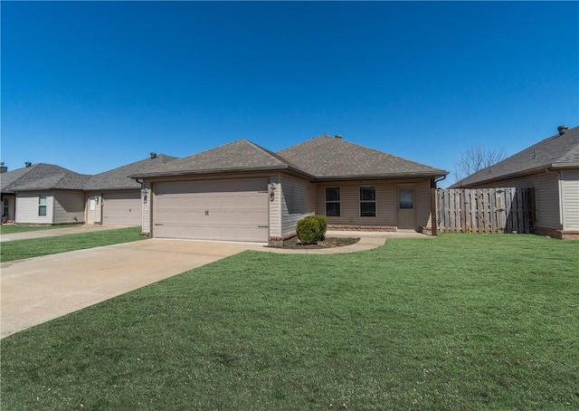 ranch-style home with a front yard, fence, roof with shingles, concrete driveway, and a garage