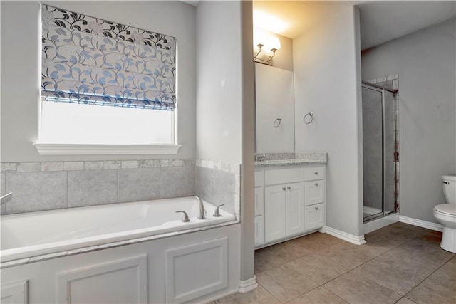 bathroom featuring vanity, tile patterned floors, toilet, and a stall shower