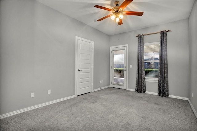 empty room with baseboards, carpet floors, and a ceiling fan