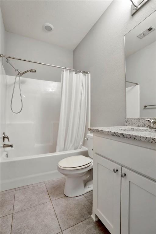 full bathroom featuring tile patterned floors, visible vents, toilet, shower / bath combo, and vanity