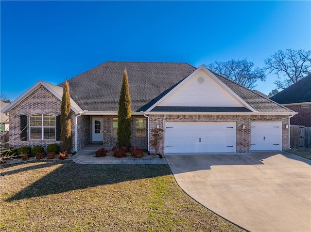 ranch-style house featuring brick siding, driveway, an attached garage, and a front yard