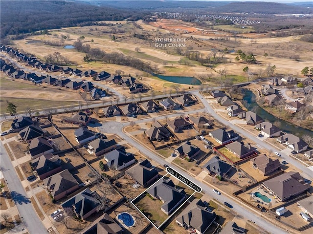 drone / aerial view featuring a residential view and a water view