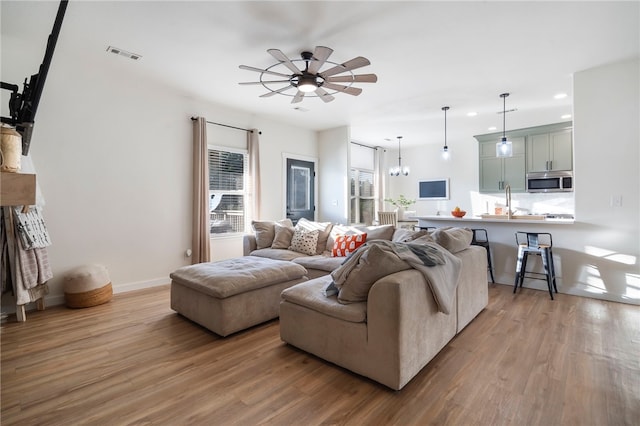 11526 Giles Rd, Farmington, AR 72730 - living room featuring wood finished floors, recessed lighting, ceiling fan, and baseboards