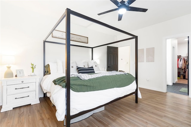 11526 Giles Rd, Farmington, AR 72730 - bedroom featuring light wood finished floors, ceiling fan, and baseboards