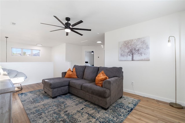 11526 Giles Rd, Farmington, AR 72730 - living room featuring a ceiling fan, wood finished floors, baseboards, and attic access