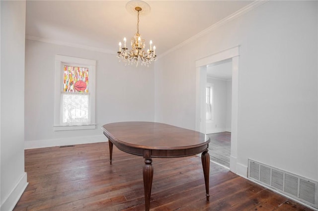 dining space with visible vents, dark wood-style floors, an inviting chandelier, crown molding, and baseboards