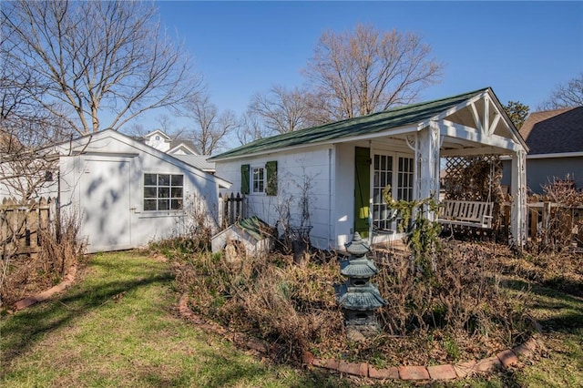 back of house with a yard