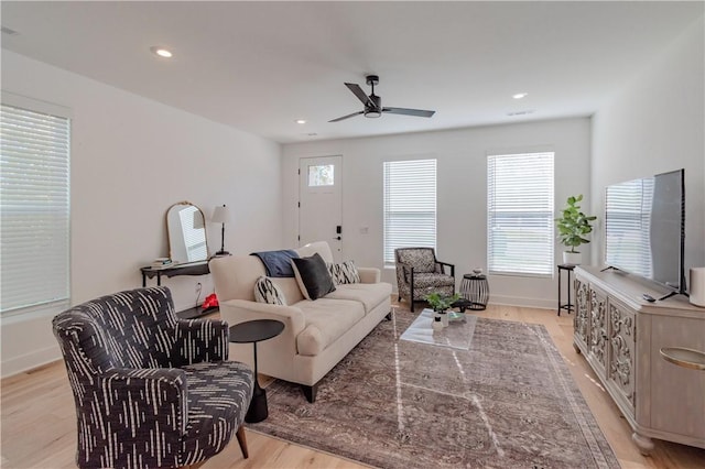 living room with recessed lighting, baseboards, light wood-style flooring, and ceiling fan