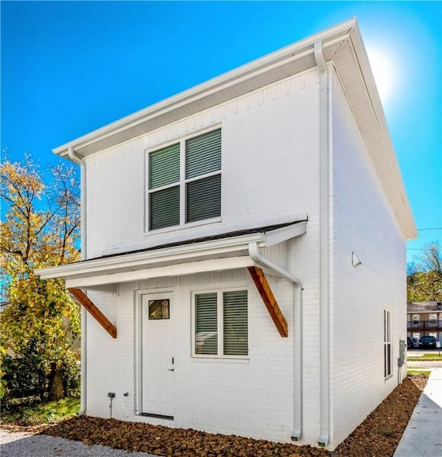 view of front of property featuring brick siding