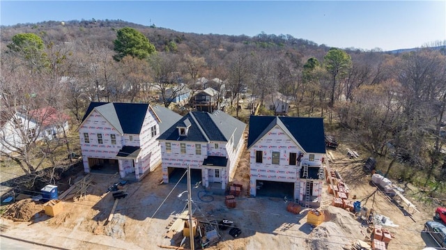 aerial view with a wooded view