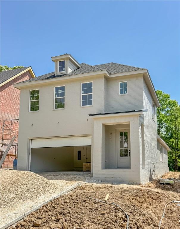 364 S College Ave, Fayetteville, AR 72701 - view of front of property featuring brick siding, a garage, and driveway