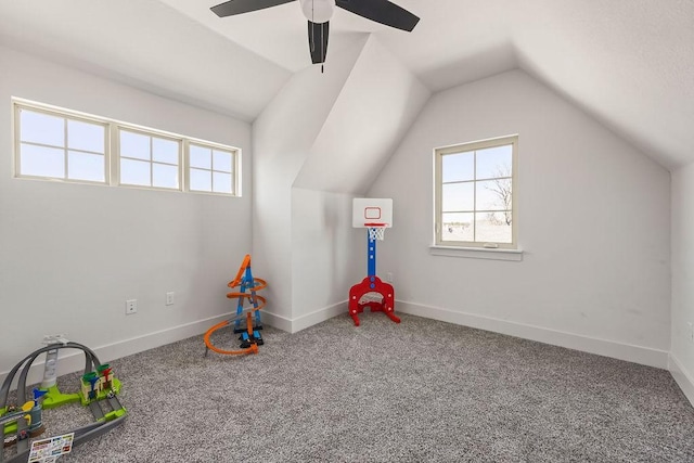 rec room featuring lofted ceiling, a healthy amount of sunlight, and baseboards