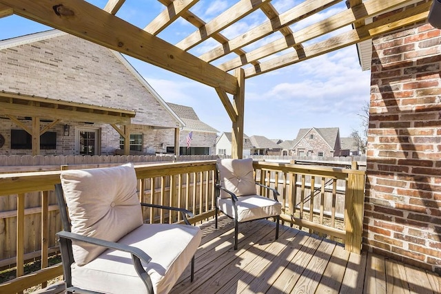 deck with a residential view and a pergola