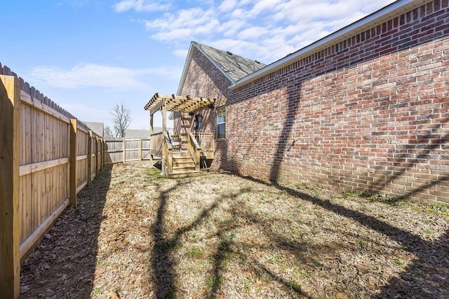 view of yard with a fenced backyard and a pergola