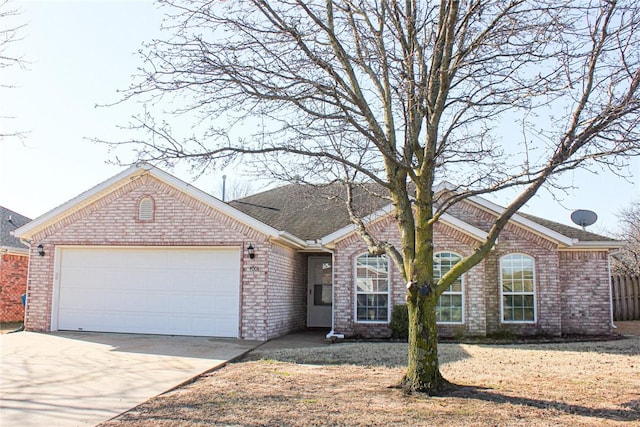 ranch-style house with an attached garage, fence, brick siding, and driveway