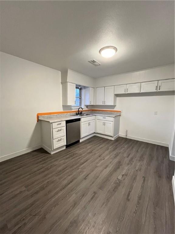 kitchen featuring visible vents, dark wood finished floors, dishwasher, light countertops, and white cabinetry