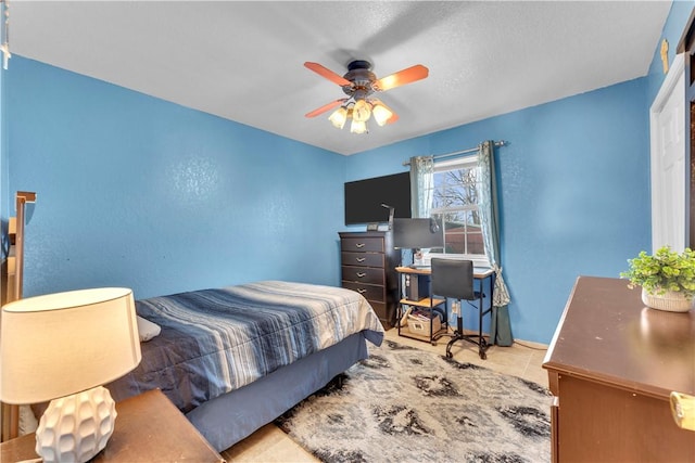 bedroom featuring tile patterned flooring and a ceiling fan