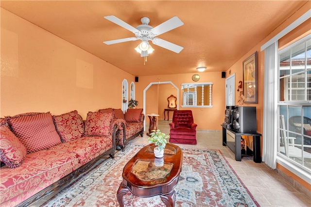 living area with ceiling fan