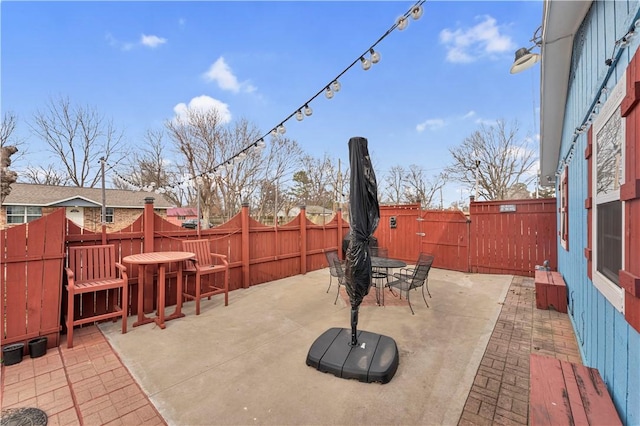 view of patio / terrace featuring outdoor dining area and a fenced backyard