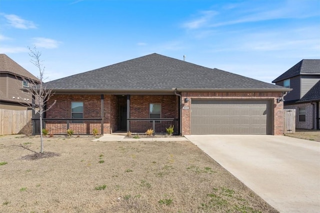 ranch-style house with a porch, an attached garage, brick siding, and a shingled roof