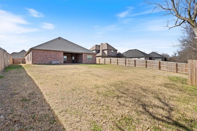 view of yard featuring a fenced backyard