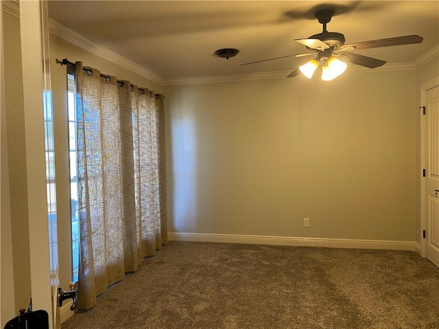 empty room with carpet flooring, a ceiling fan, baseboards, and ornamental molding