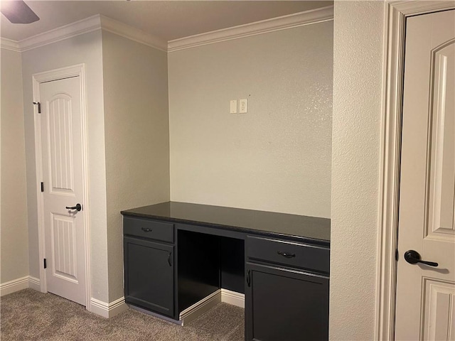 interior space featuring baseboards, carpet, and crown molding