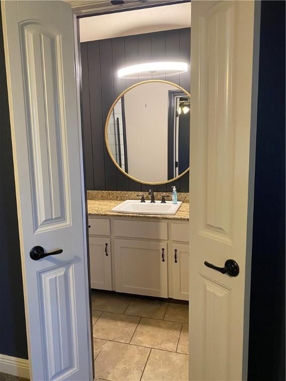 bathroom with tile patterned floors and vanity