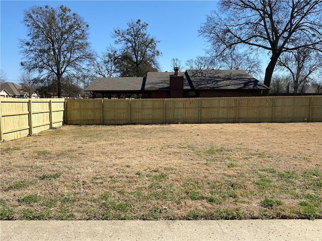 view of yard with a fenced backyard