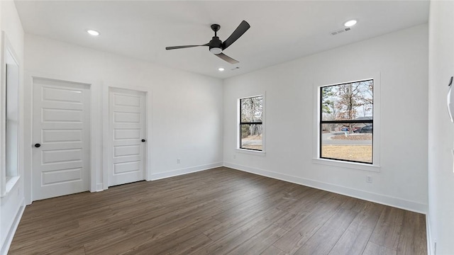 unfurnished bedroom with recessed lighting, visible vents, baseboards, and dark wood-type flooring