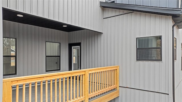 view of exterior entry featuring a wooden deck