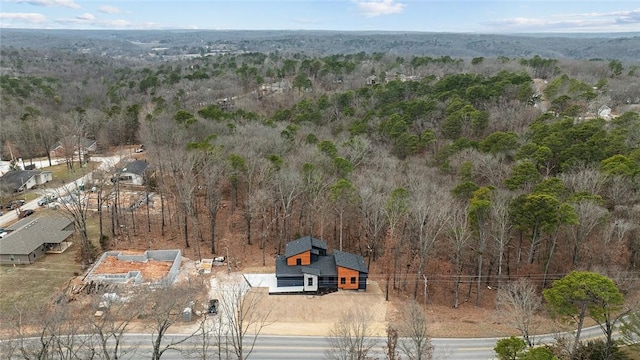 drone / aerial view with a view of trees