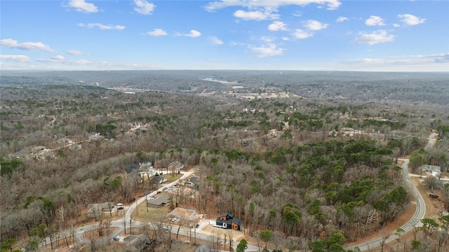 birds eye view of property with a wooded view