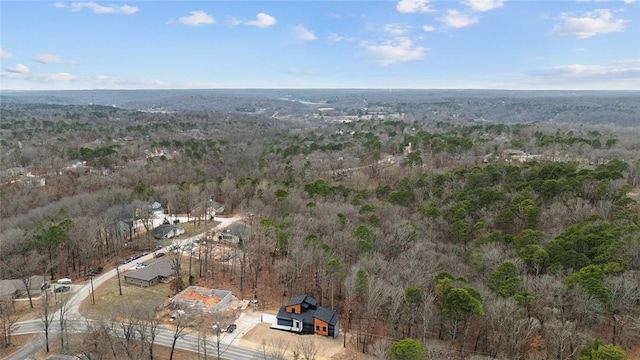 birds eye view of property with a view of trees