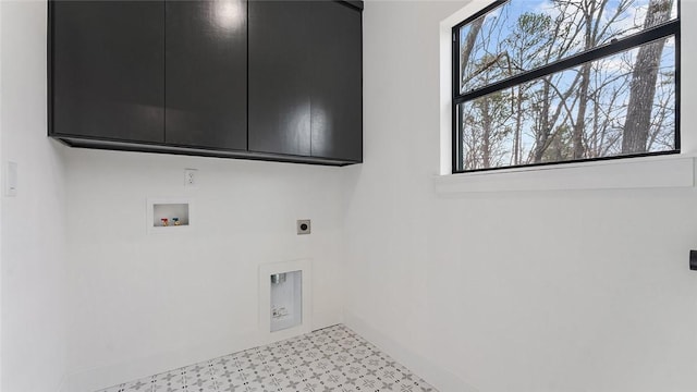 washroom featuring baseboards, light floors, washer hookup, cabinet space, and electric dryer hookup