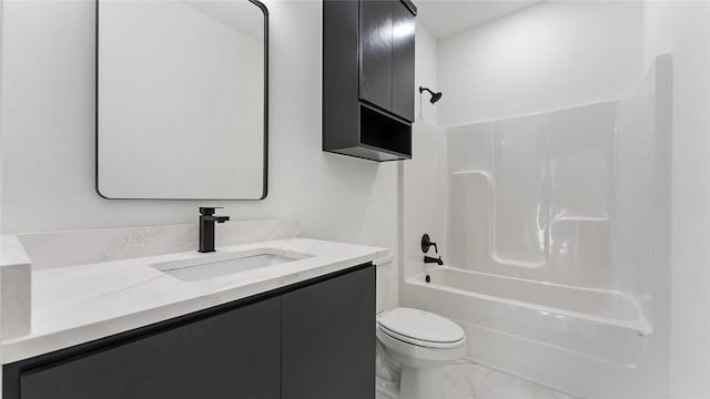 bathroom with toilet, vanity, and shower / bathing tub combination