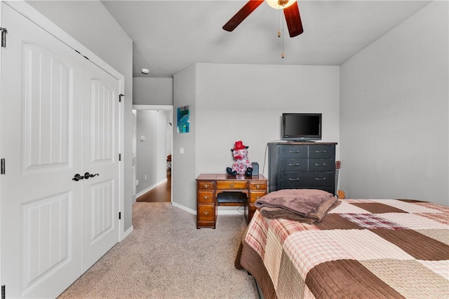 bedroom featuring ceiling fan, baseboards, and light carpet